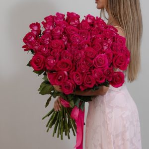 A stunning bunch of fresh, long-stemmed dark pink "All For Love" roses.