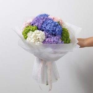 A full view of the luxury Petal Cloud bouquet, highlighting its mix of colorful hydrangeas.
