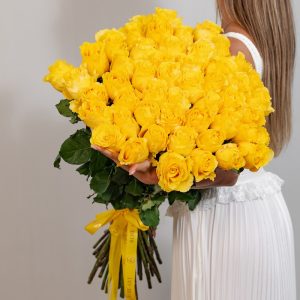 A stunning bunch of fresh, long-stemmed yellow Armine roses.