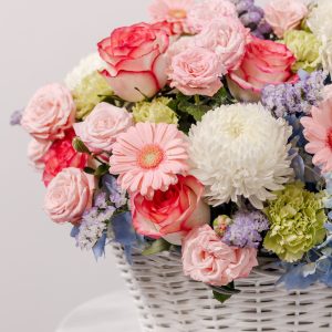 A close-up side view of the Cotton Candy basket, showing the detail of the blue hydrangeas and white peonies.