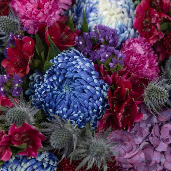 A top-down view of the dark-colored Midnight Bloom bouquet, highlighting its rich textures and tones.