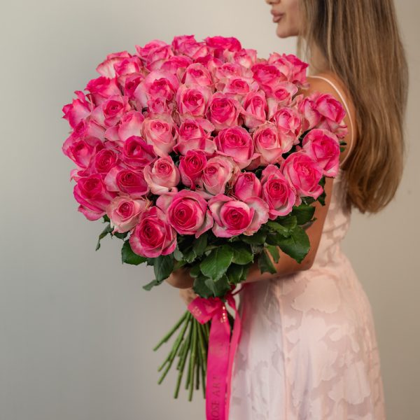 A stunning bunch of fresh, long-stemmed Candy Avalanche roses with bi-color pink and white petals.