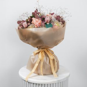 A top-down view of the brown Classic Elegance bouquet, highlighting the mix of exotic flowers.