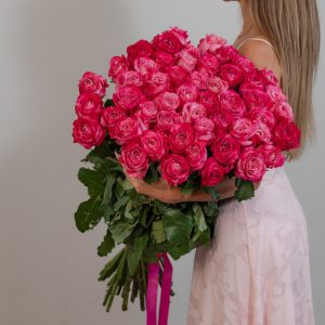 A stunning, full bunch of fresh, long-stemmed Deep Water roses with unique lilac-colored petals, arranged against a clean background.