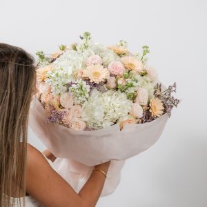 A full shot of the luxury "Soft Serenade" bouquet, highlighting its elegant and soft pastel colors.