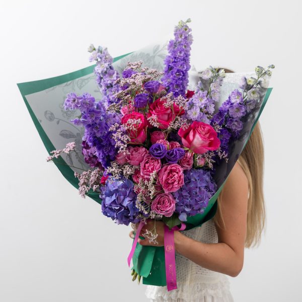 A full shot of the luxury "Art of Purple" bouquet, highlighting its clean, sophisticated look.