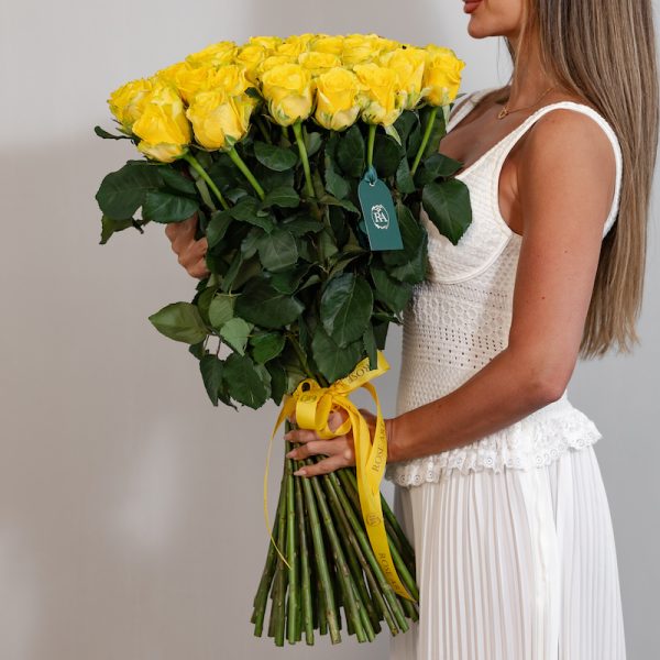 A close-up side view of the Penny Lane roses, showcasing their unique green-yellow petals and delicate details.