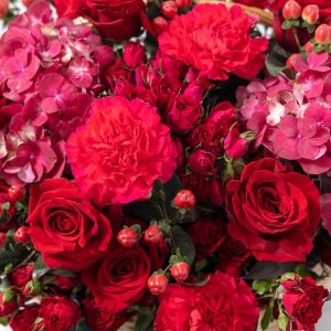 A top-down view of the Red Classic floral basket, highlighting its rich textures and classic composition.