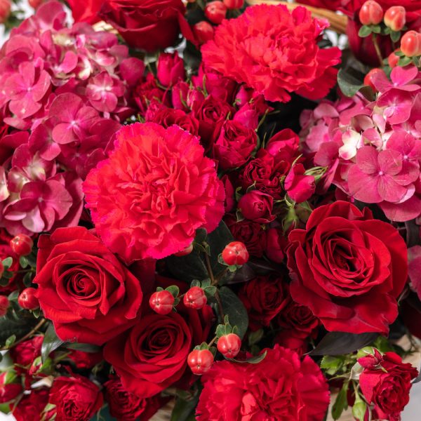 A top-down view of the Red Classic floral basket, highlighting its rich textures and classic composition.