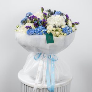 A side view of the Azure Serenity bouquet, showcasing its volume and composition.