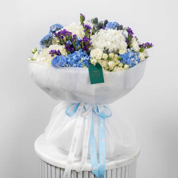 A side view of the Azure Serenity bouquet, showcasing its volume and composition.