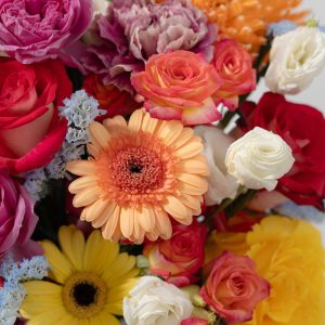 A top-down view of the Sunset in Bali flower box, highlighting the full arrangement of colorful flowers.