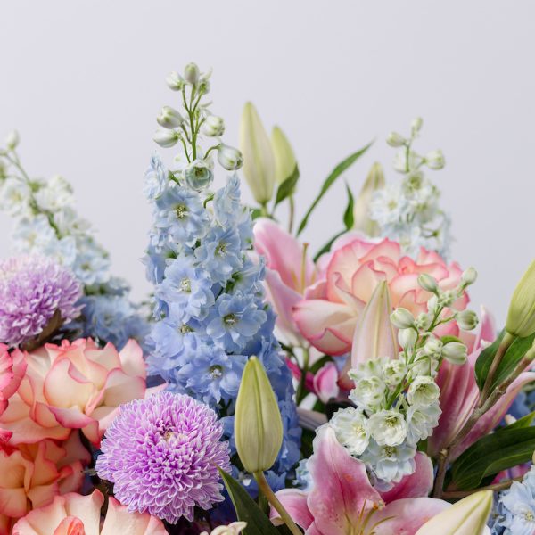 A full view of the Eden Charm flower basket, showcasing its rich, colorful mix and lush design.