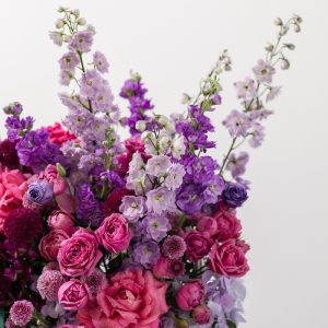 A close-up side view of the Art of Purple basket, showing the detail of the various purple blooms.