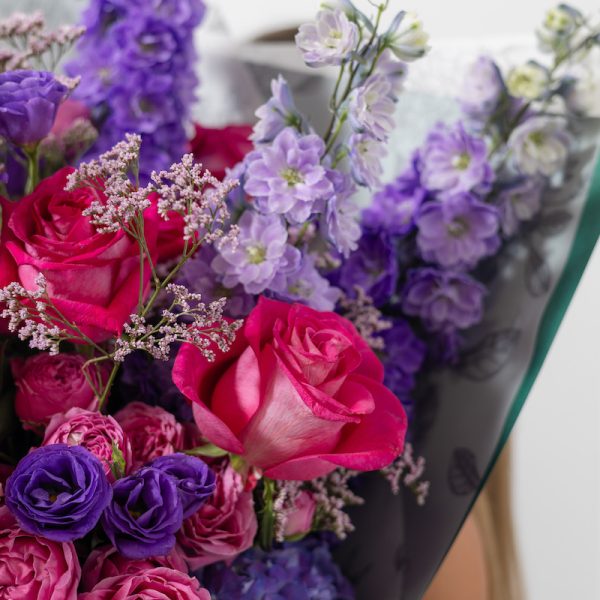 A top-down view of the Art of Purple bouquet, highlighting its harmonious mix of blooms.