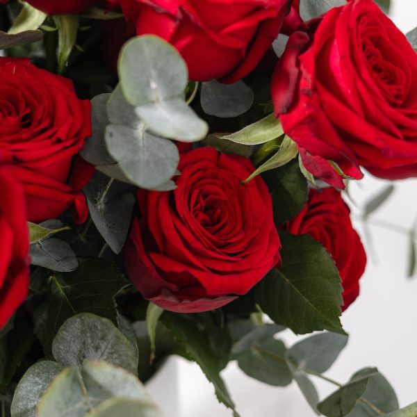 A full view of the Aroma flower box, showing the beautiful red roses and green eucalyptus.