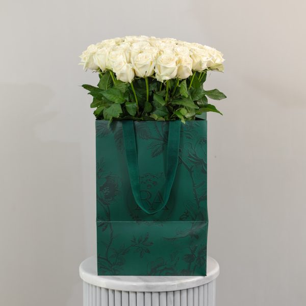 A view of the Dolomiti white rose bouquet from a different angle, showcasing its full volume and stem length.